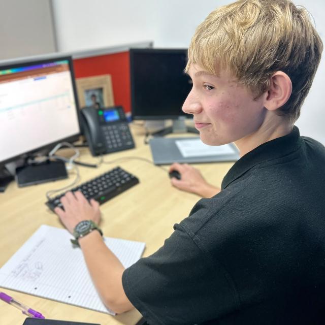 Jack Brown at his desk working on client websites
